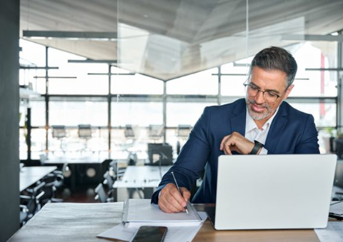 A financial advisor at Forever Young working in the office, offering expert financial planning and advice to clients in Port St. Lucie, ensuring their financial security.